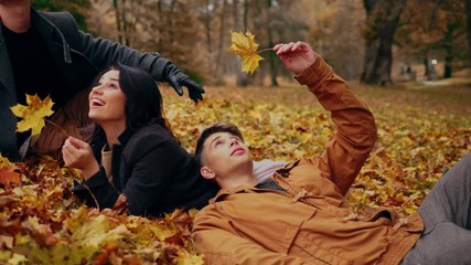 Friends having fun in autumn park