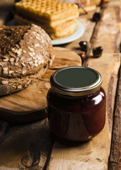 High angle assortment with baked food and jam jar