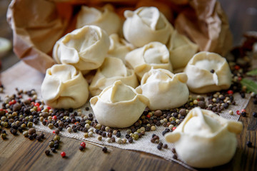 Fototapeta na wymiar Homemade meat dumplings - russian pelmeni.