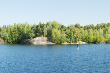 Fototapeta premium Small rocky island in lake Saimaa, near lappeenranta, Finland.