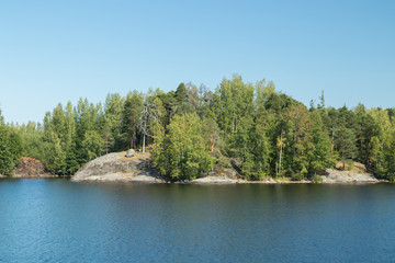 Obraz premium Small rocky island in lake Saimaa, near lappeenranta, Finland.