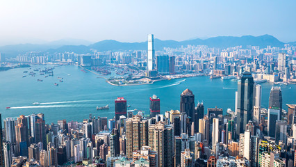 High view of Hong Kong skyline cityscape over Victoria harbour in the afternoon at Victoria Peak
