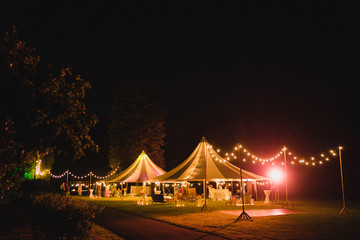 Coziness and style. Modern event design. Lounge zone and wedding reception decorations outdoors in...