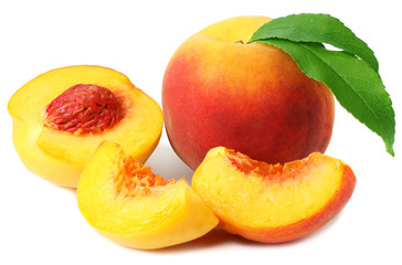 peach fruit with green leaves and slices isolated on white background