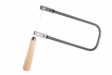Fret saw (tools supplies) for cutting out of plywood lies  . fret saw or Craftsman tool isolated on...