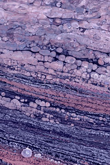 Fototapeta premium Blurred abstract background. Mixing different colors of paint. Cropped shot, vertical, close-up, no people, free space. Design concept.