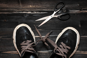 unchained concept -learn how to tie shoelaces. concept lifestyle - tied foot. radical liberation...