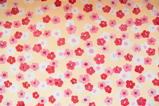 Pattern painted flower on wall texture background.
