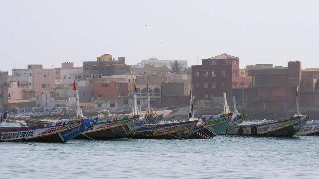 Local fishing boats anchored off the coast of Dakar