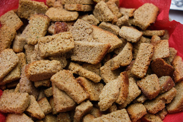 Fried rye crackers on a plate close up