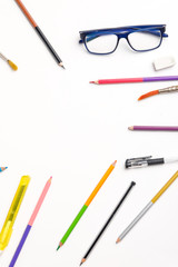 The concept of the teacher's day, School stationery, pencil, pen, note, Spectacles, tie in pen box on white background