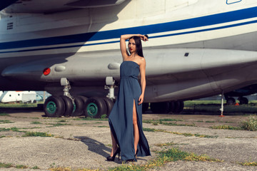 Brunette in a dress at the old airport