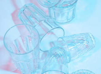 Glass faceted glasses. Color lighting. Art photography.