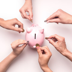 People collecting money to piggy bank for spending on Crowdfunding
