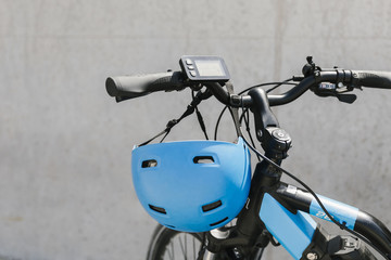 Close up e-bike with helmet on handlebar