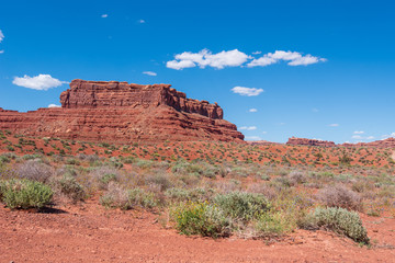 Landscape of large red buttes and monoliths at Valley of the Gods in Utah