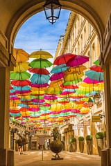 colorful umbrellas in village royale paris, france.