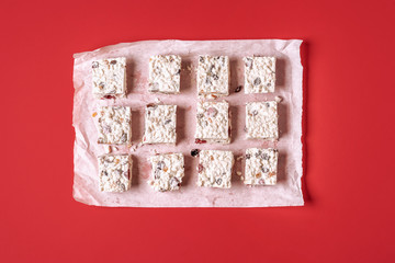 Australian white Christmas cake on a red background. Christmas sweets