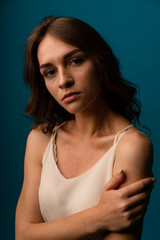 Young attractive woman at home feeling sad tired and worried suffering depression in mental health, problems and broken heart concept.