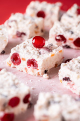 White Christmas cake with dried cherries. Close-up Australian dessert