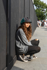 Emotionless girl with colorful hat