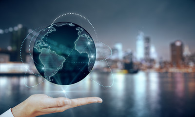 Global internet network concept with man hand projecting world map with glowing lines around
