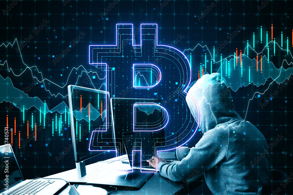 Aufkleber Hacking concept with hacker using laptop and bitcoin sign at business chart background.