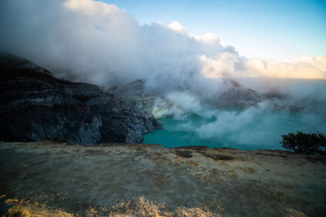 Aerial view of beautiful Ijen volcano with acid lake and sulfur gas going from crater, Indonesia