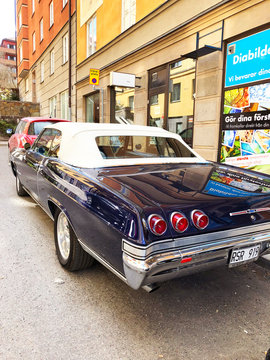 Stockholm, Sweden, April 24 2018: Back view of old retro classic car Chevrolet Impala SS 1965 on city street. Car detailing