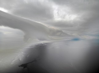 Giant Tubular Cloud Rolling Across the Sea view from top copter. Strange clous in the sea. Storm 
