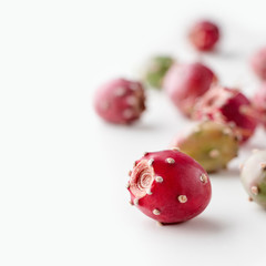 Prickly pear fruit on a white background, creative flat lay food concept with copy space, prickly pear cactus, Opuntia ficus-indica