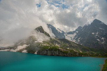 Alpine lake Klukhor with beautiful water and surrounded by mountains in the Caucasus in the Karachay-Cherkess Republic