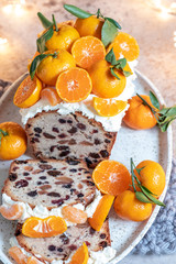 Christmas fruit cake decorated with a clementines