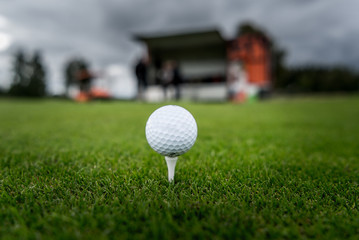 Golf ball on peg