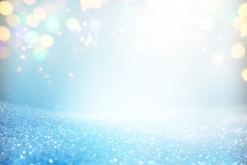 blackground of abstract glitter lights. blue, gold and silver. de focused