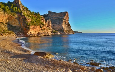 Fototapeta na wymiar Beautiful beach in Spain with steep cliffs.
