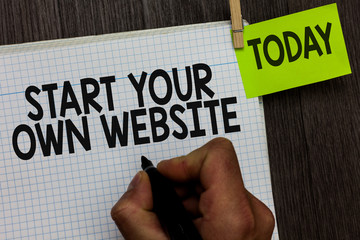 Word writing text Start Your Own Website. Business concept for serve as Extension of a Business Card a Personal Site Man holding marker notebook clothespin hold reminder wooden background