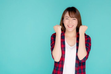 Fototapeta premium Beautiful portrait young asian woman smiling confident and excited summer holiday isolated blue background, beauty asia model girl enjoy and cheerful success with journey, travel concept.