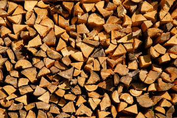 Stacked pile of logs , wood texture background.
