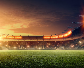 Soccer stadium with tribunes, cheering fans and dramatic night sky. 