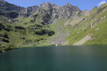  A small deep lake in the middle of the mountains