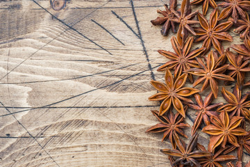 Badian Star anise on a wooden background. Selective focus.