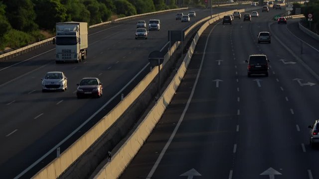 4K. Ultra HD. Aerial view of vehicles traveling the road under the afternoon light. Safe driving on the road. Engravings in the round trip. Holidays.