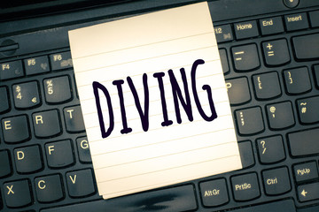Writing note showing Diving. Business photo showcasing sport or activity of swimming into water using oxygen and suit.
