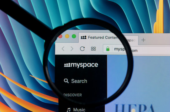 Sankt-Petersburg Russia, January 11, 2018: Apple iMac with Myspace homepage on monitor screen under magnifying glass. Myspace is online social networking website. Homepage of Myspace.com