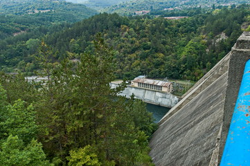 Fototapeta premium View of the old small hydro power plant and Topolnitsa dam on the river Topolnitsa near village Muhovo, Ihtiman region, Bulgaria, Europe 