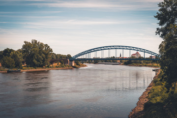 Obraz premium Old railway bridge over the Elbe in Magdeburg, Germany