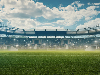 Soccer stadium with tribunes, cheering fans, blue cloudy sky and green grass. 