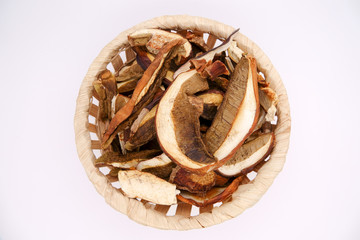Dried white mushrooms on a white background. Dried porcini mushrooms. Isolated on white background.