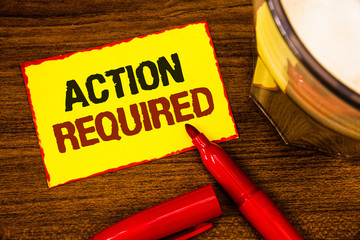 Writing note showing Action Required. Business photo showcasing Important Act Needed Immediate Quick Important Task Words yellow paper note red border open marker cap coffee glass desk
